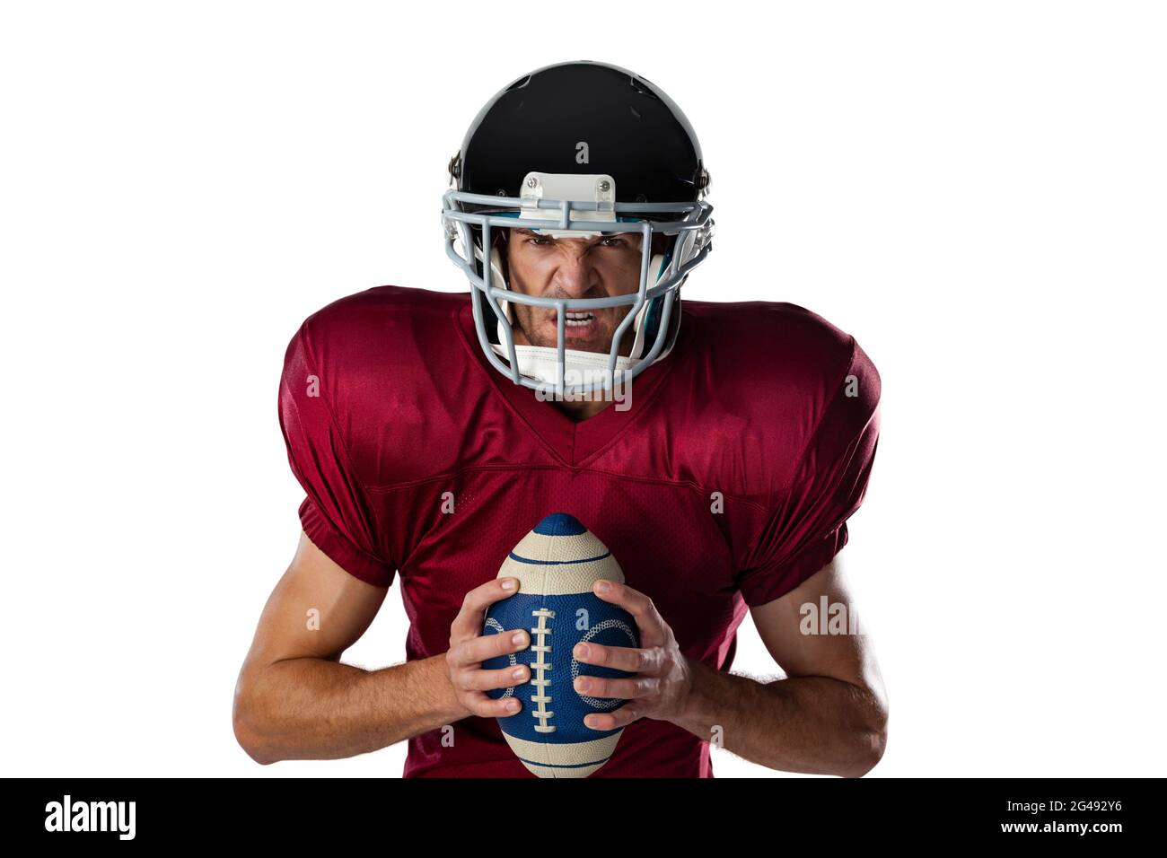 Portrait of aggressive American football player wearing helmet holding ball Stock Photo Alamy