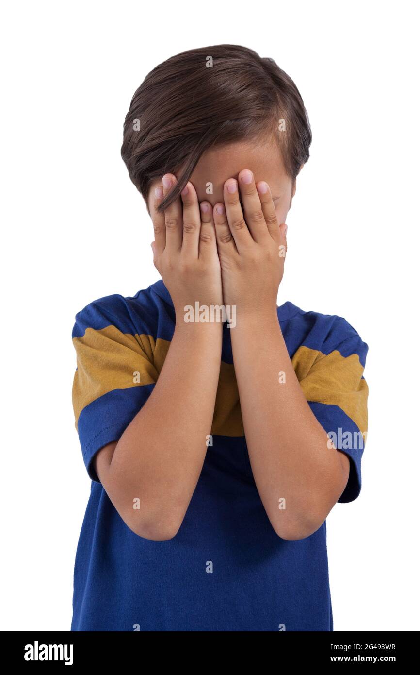 Cute boy covering his face Stock Photo Alamy
