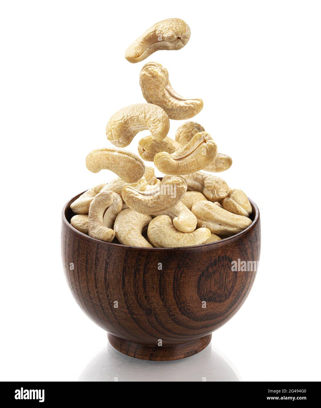 Falling cashew nuts isolated on white background Stock Photo