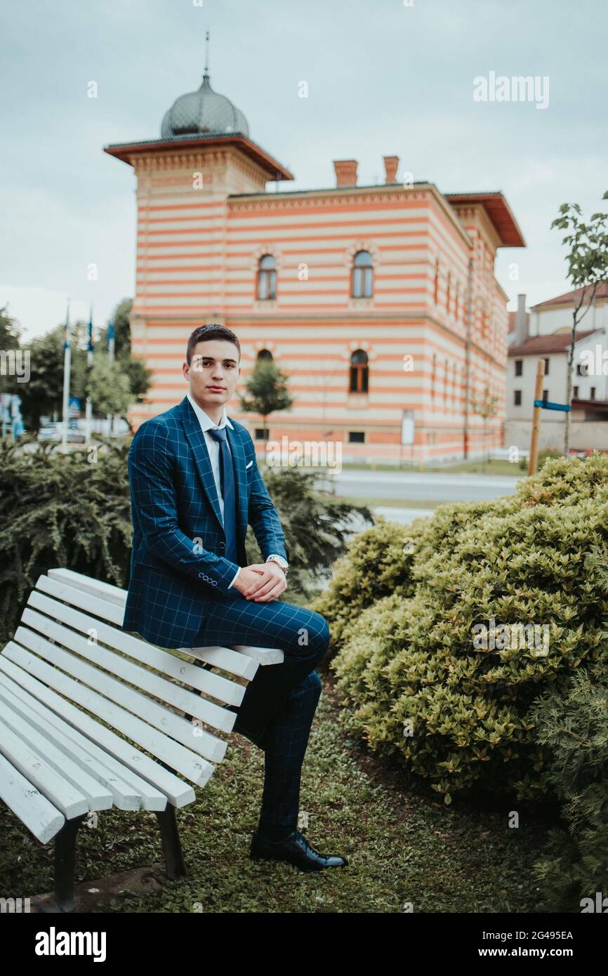 Caucasian young businessman in a suit and tie sitting outdoor Stock ...