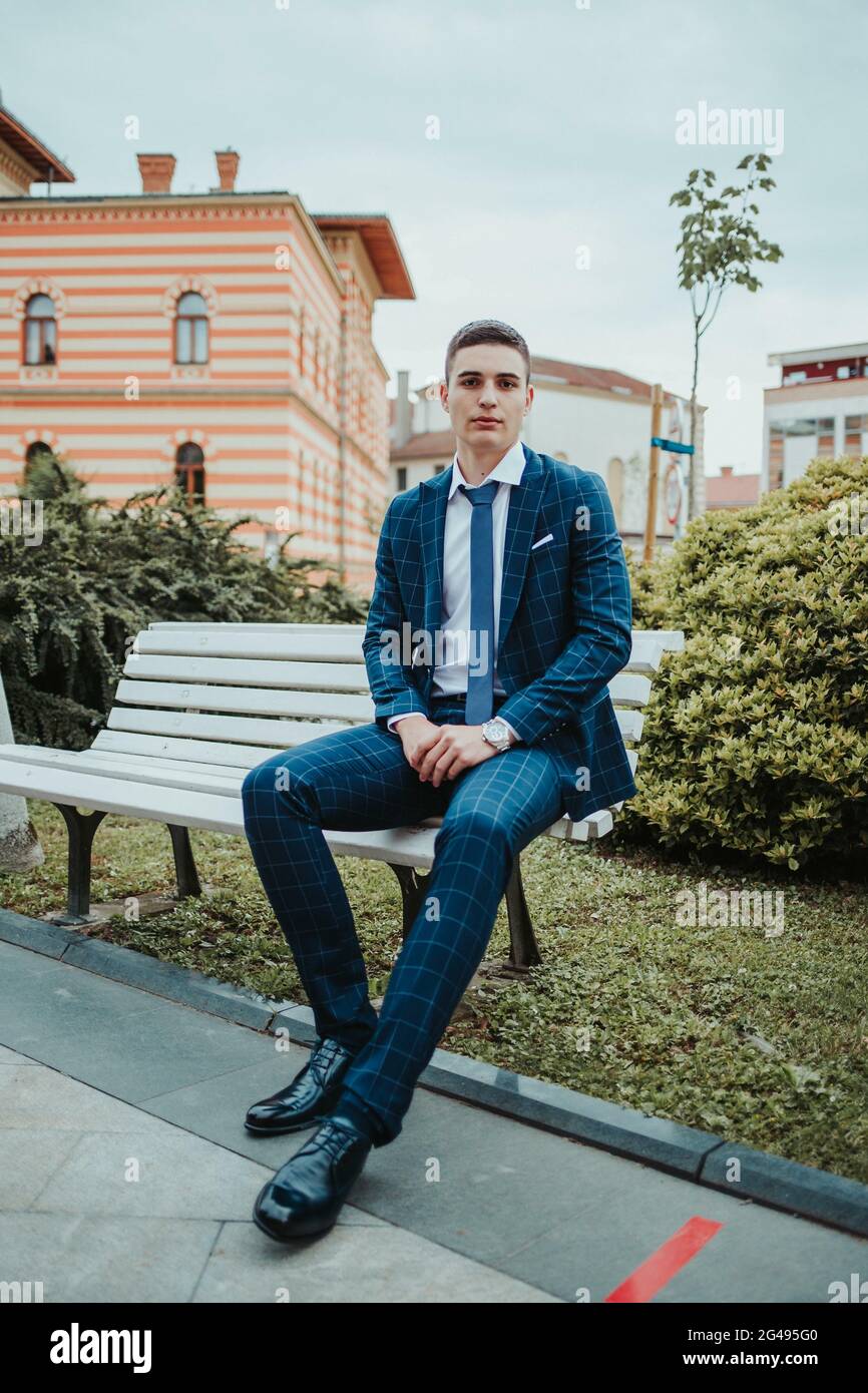A caucasian young businessman in a suit and tie standing outdoor Stock ...
