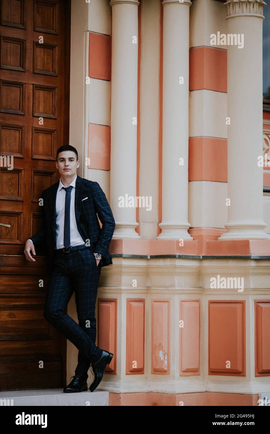 A caucasian young businessman in a suit and tie standing outdoor Stock ...