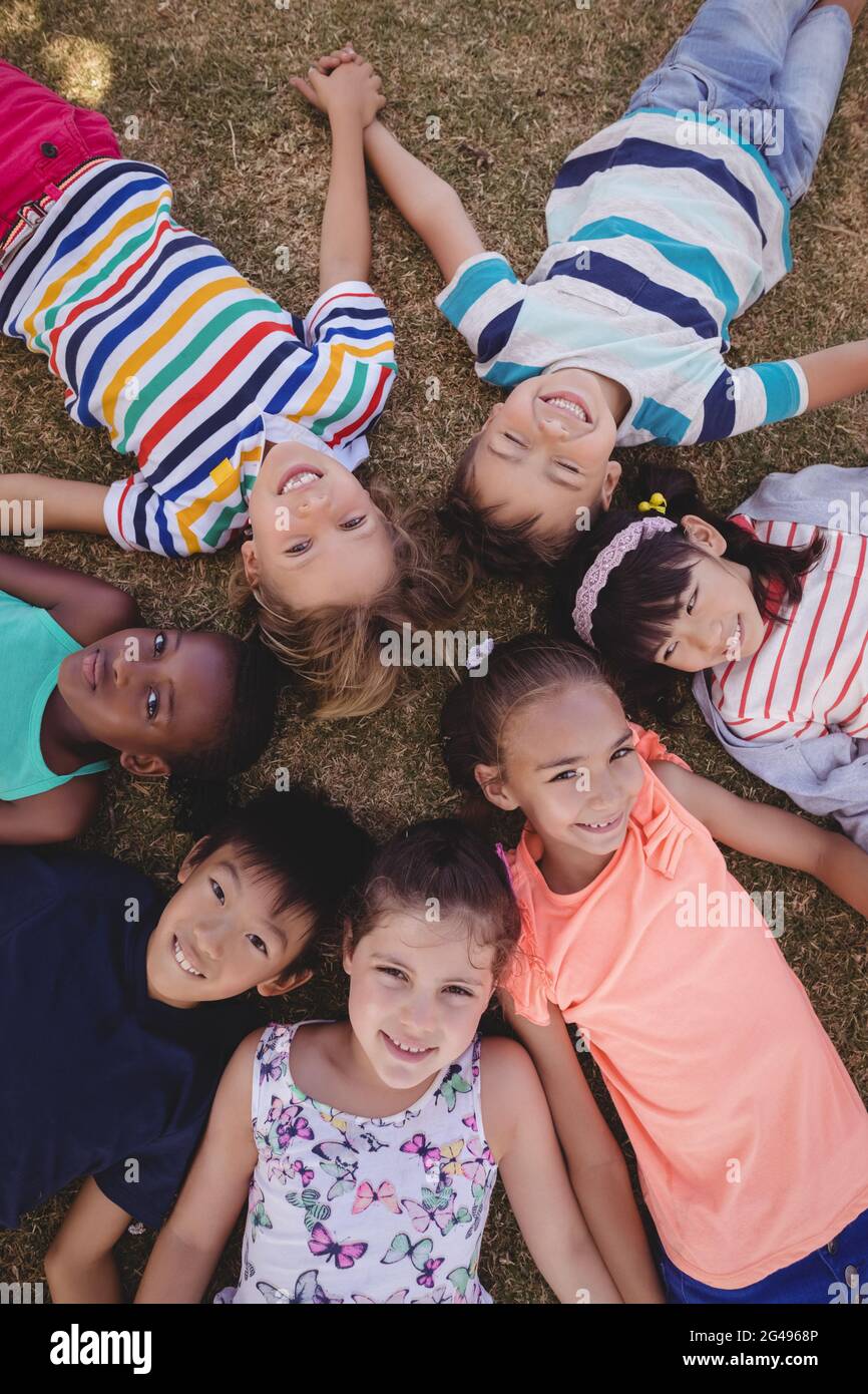 Schoolboy lying on grass hi-res stock photography and images - Alamy
