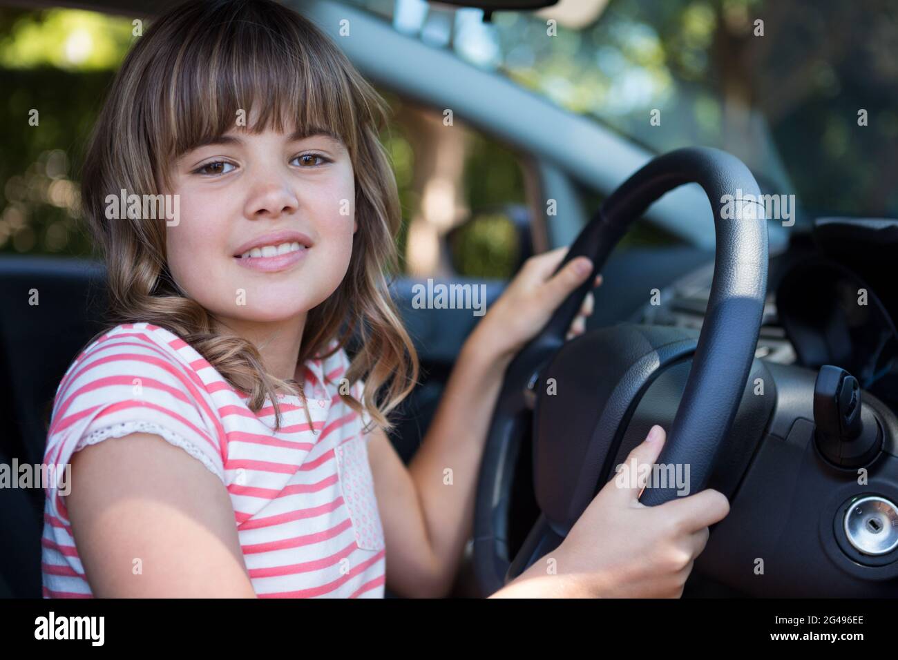 Teenage girl driving a car hires stock photography and images Alamy