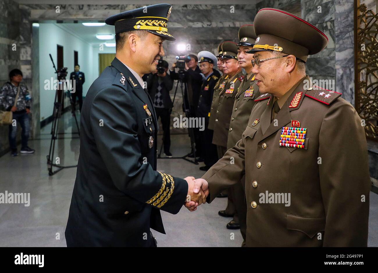 Oct 26, 2018-Paju, South Korea-South Korean Maj. Gen. Kim Do-gyun, left, tries to shake hands with his North Korean counterpart Lt. Gen. An Ik San during a meeting at the border village of Panmunjom, North Korea, Friday, Oct. 26, 2018. North and South Korea are holding military talks on their border to discuss implementing a broad-reaching military agreement last month to reduce tensions. Stock Photo