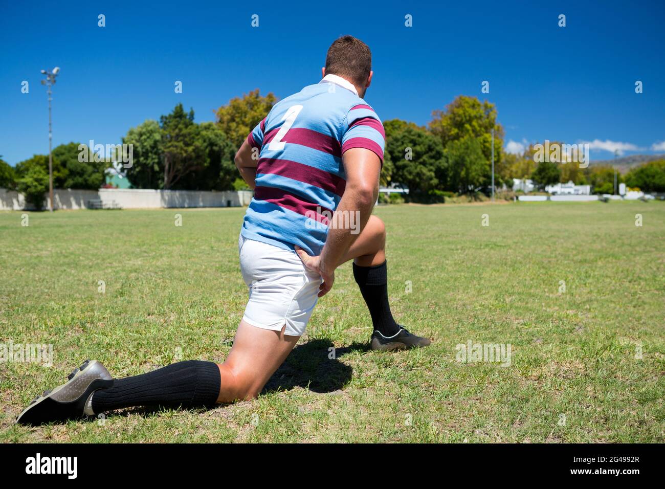 Kneeling man rear view hi-res stock photography and images - Alamy