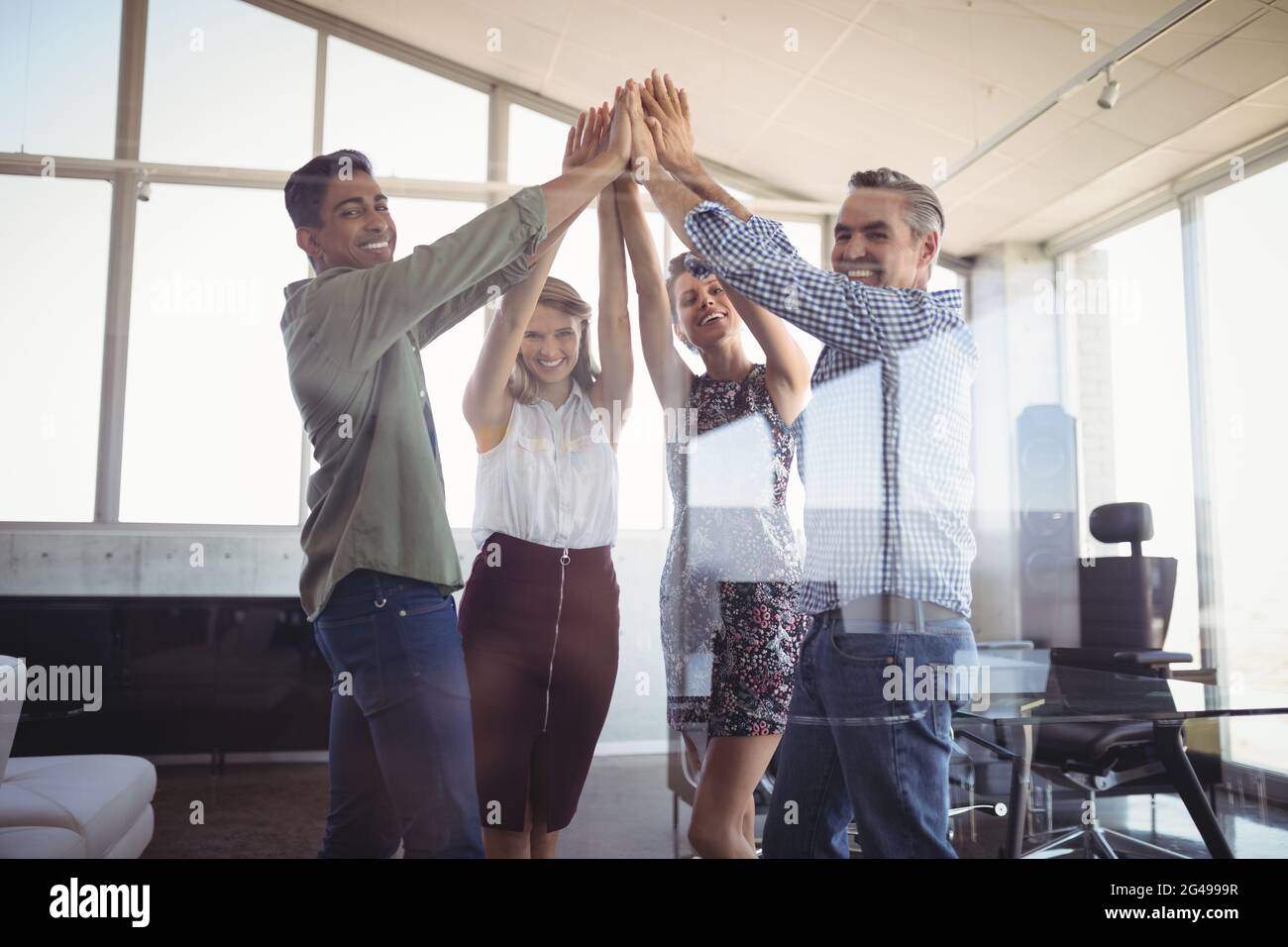 Business people raising hands hi-res stock photography and images - Alamy