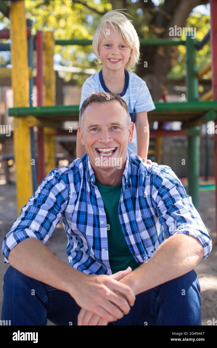 Father son playground together hi-res stock photography and images - Alamy
