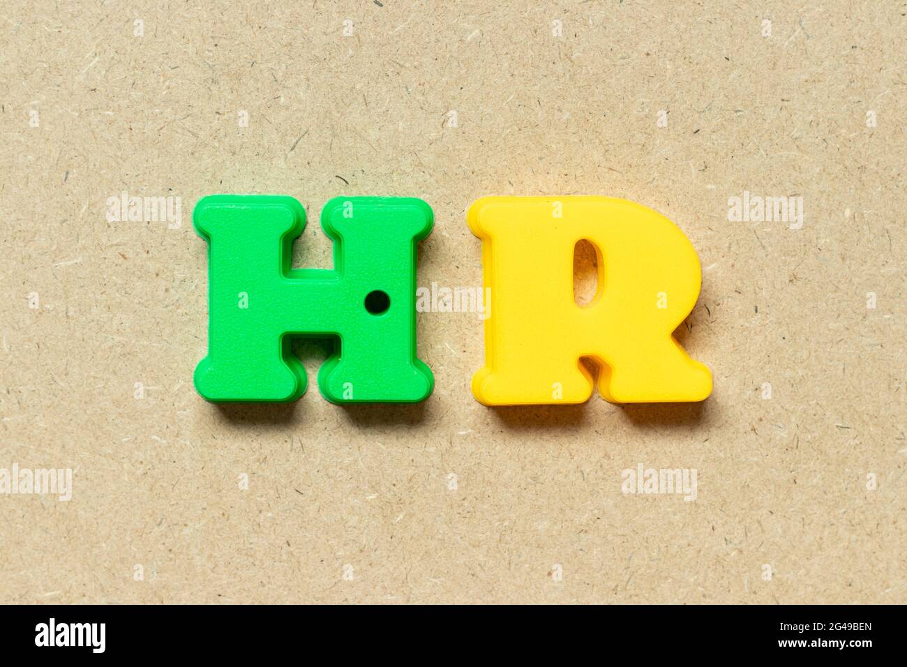 Plastic alphabet letter in word HR (Abbreviation of human resource) on