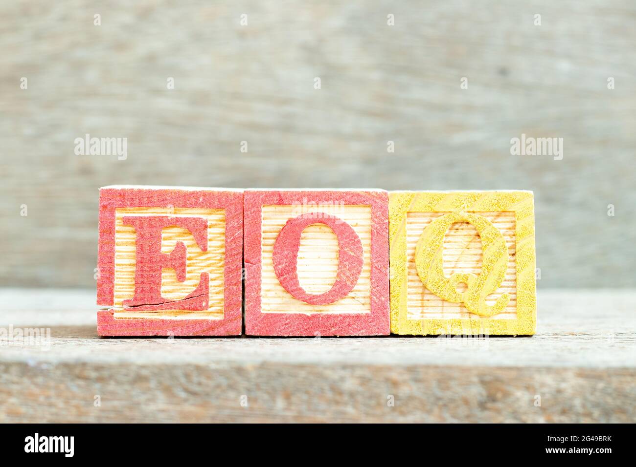 Color alphabet letter block in word EOQ (Abbreviation of Economic order quantity) on wood