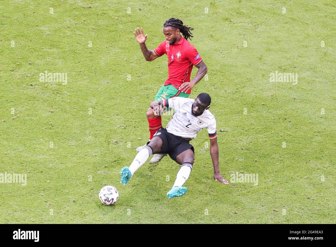 Munich, Germany. 19th June, 2021. Renato Sanches (top) of Portugal vies with Antonio Ruediger of Germany during the UEFA Euro 2020 Championship Group F match in Munich, Germany, June 19, 2021. Credit: Shan Yuqi/Xinhua/Alamy Live News Stock Photo