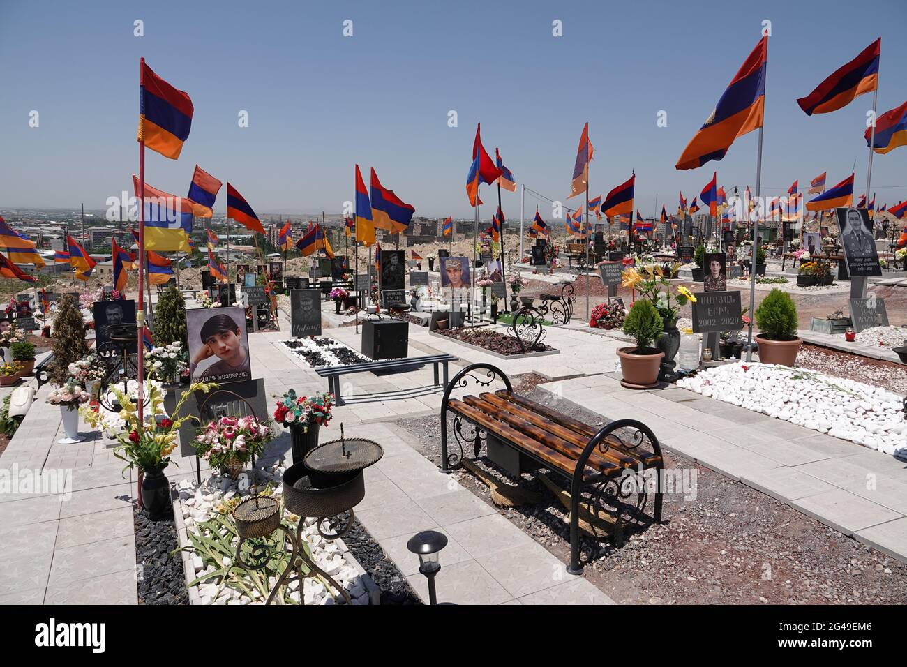 Eriwan, Armenia. 19th June, 2021. The graves of Armenian soldiers who died in the autumn war with Azerbaijan over the conflict region of Nagorno-Karabakh, in the city's military cemetery. Seven months after the war, the crisis-ridden South Caucasus republic of Armenia holds an early parliamentary election on June 20, 2021. Credit: Ulf Mauder/dpa/Alamy Live News Stock Photo