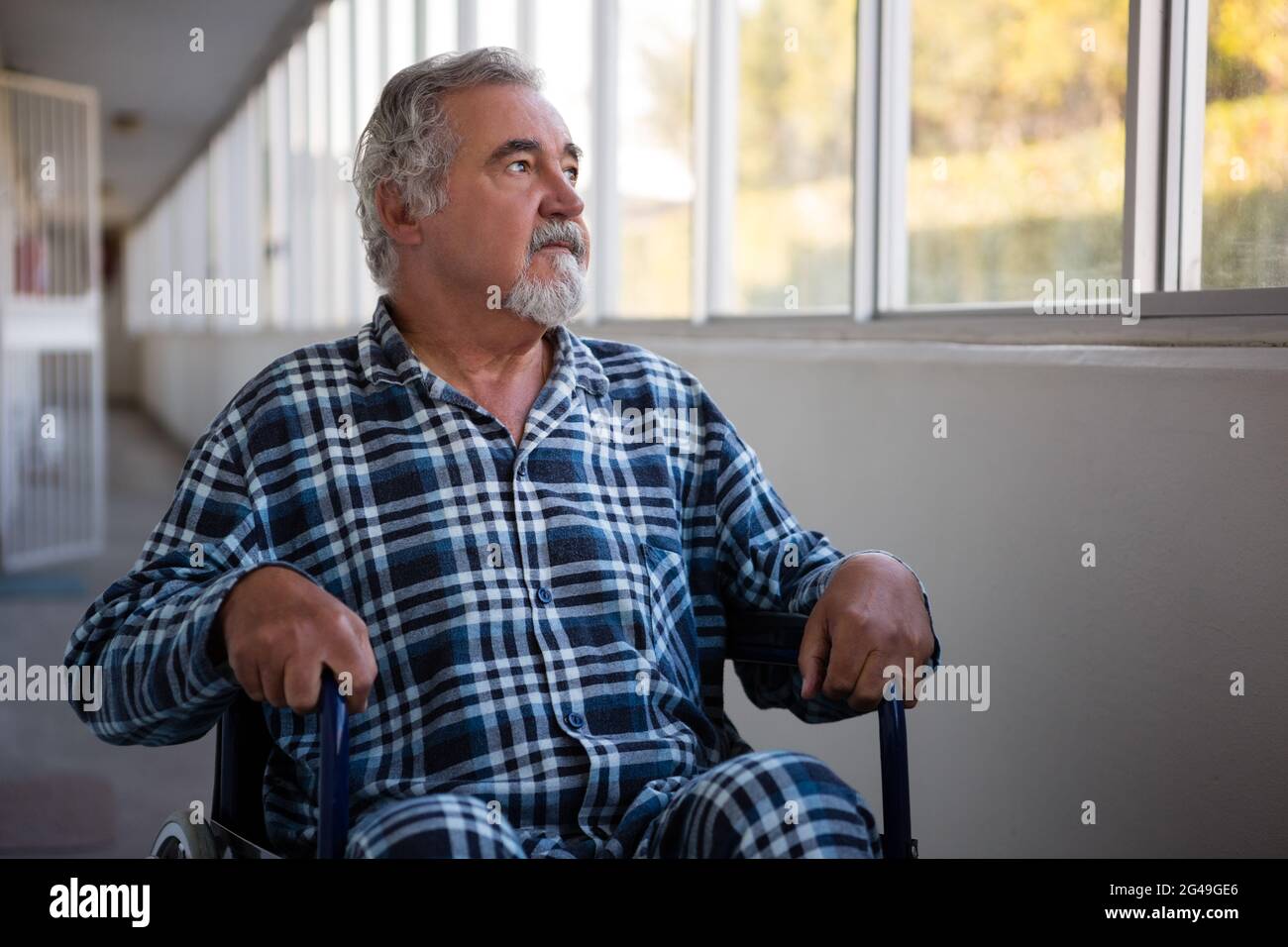 Wheelchair thinking elderly man hi-res stock photography and images - Alamy