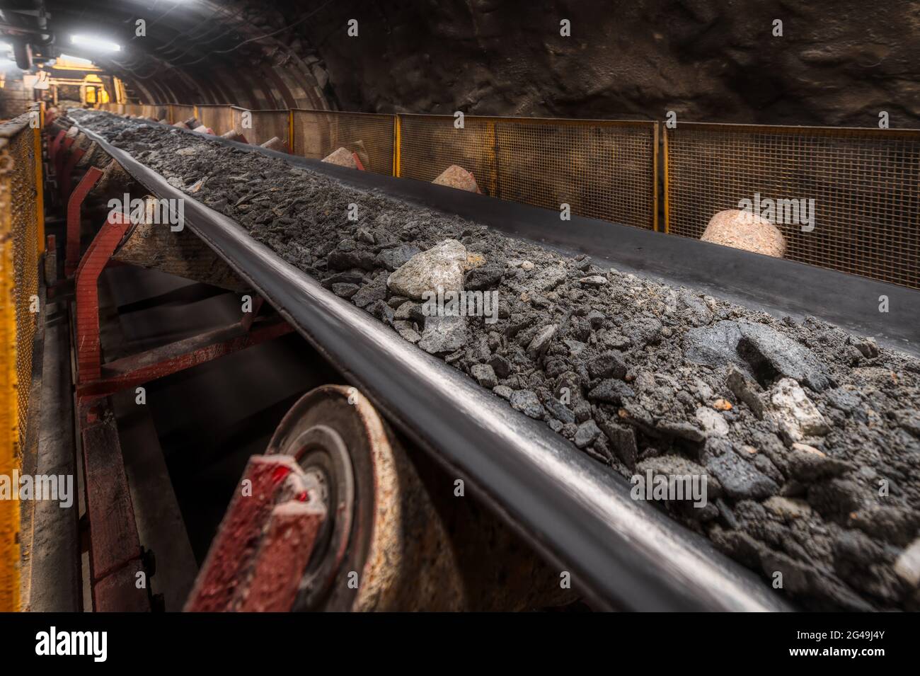 Belt conveyor with ore Underground mining Stock Photo Alamy