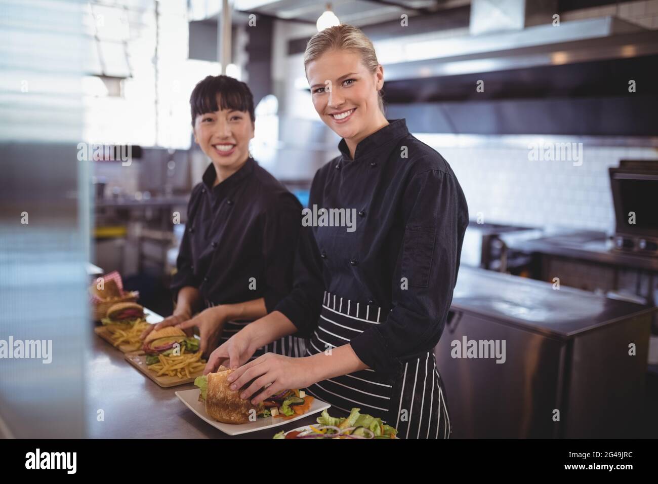 Two pretty female chefs looking hi-res stock photography and images - Alamy