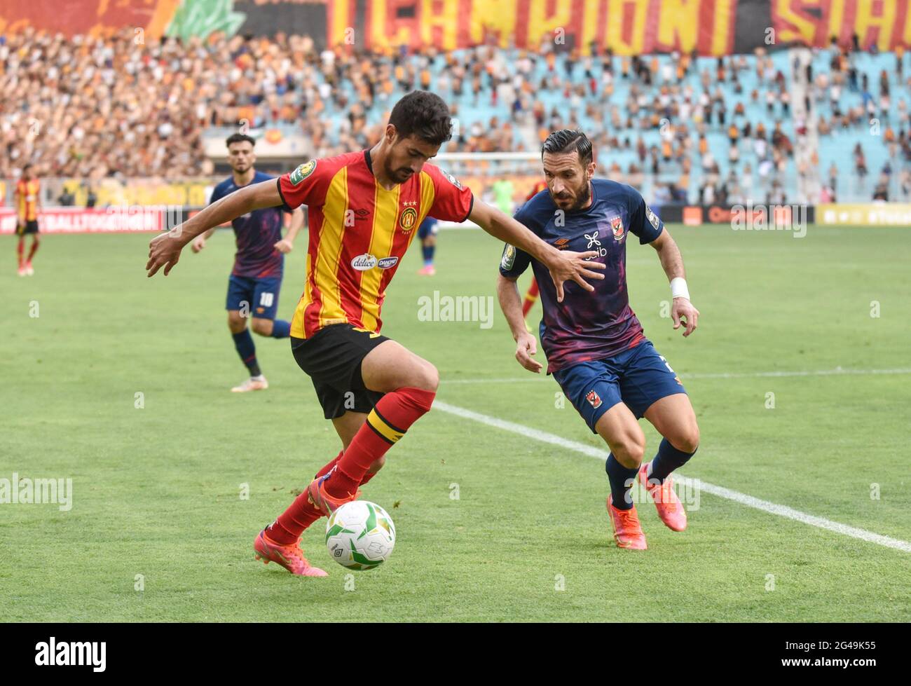 Tunis, Tunisia. 19th June, 2021. Esperance player Mohamed Ali Ben Romdhane and Ahly player Ali Maaloul in action during the first leg CAF champions league semi-final football match between Tunisia's Esperance Sportive de Tunis and Egypt's al-Ahly at the Olympic Stadium in Rades. (Final score; Esperance sportive 0: 1 Egypt's al-Ahly). (Photo by Jdidi wassim/SOPA Images/Sipa USA) Credit: Sipa USA/Alamy Live News Stock Photo