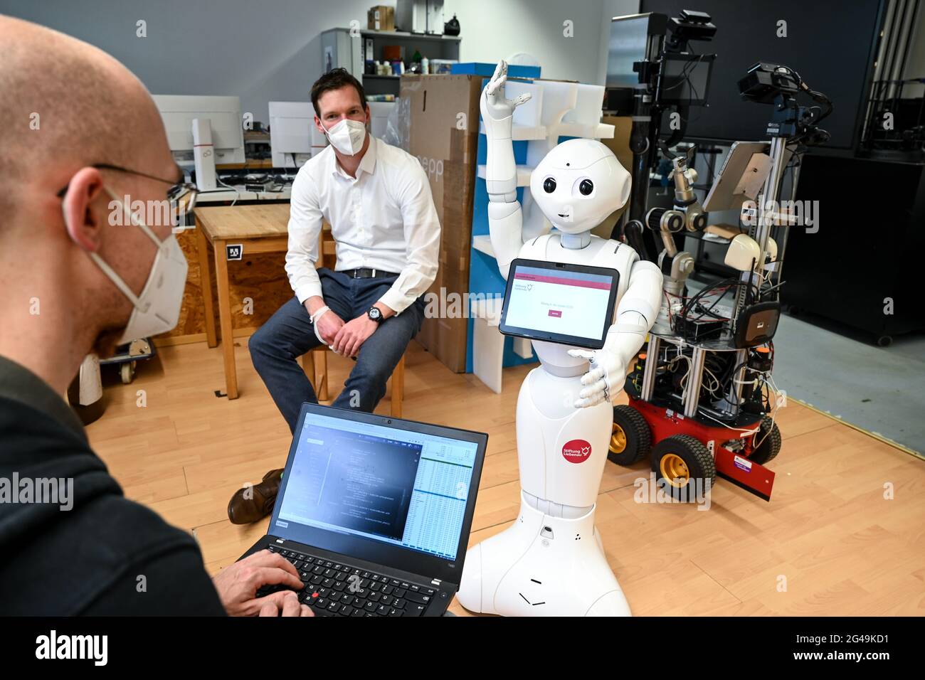 Weingarten, Germany. 26th May, 2021. Benjamin Stähle (l), deputy head of  the Institute for Artificial Intelligence at Ravensburg-Weingarten  University of Applied Sciences, and Julian Krüger, head of the Magdalena  nursing home in