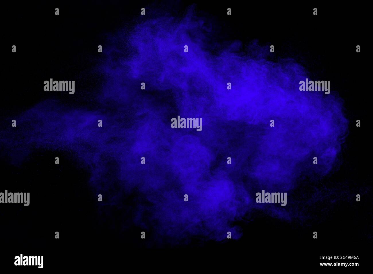 Blue color dust particles splash on black background. Stock Photo