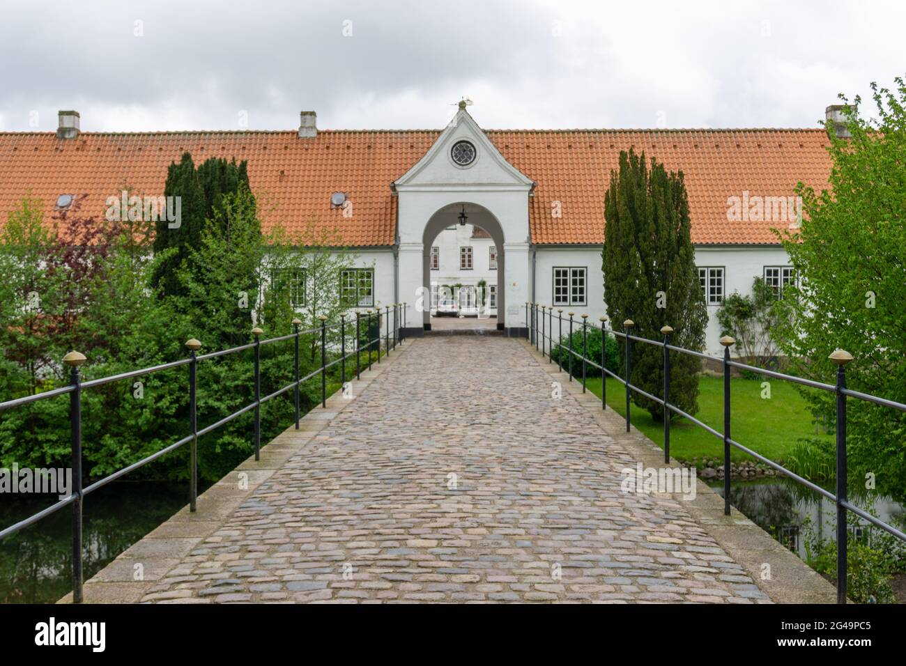 View of the bridge and gate leading into the courtyard of the Glucksburg castle Stock Photo