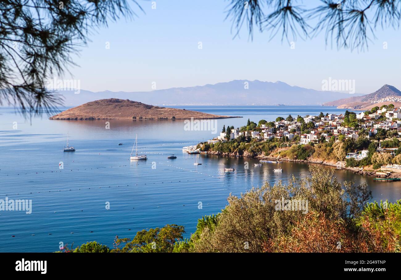 Aegean coastline with wonderful blue water, rich nature, islands, mountains and small white houses Stock Photo