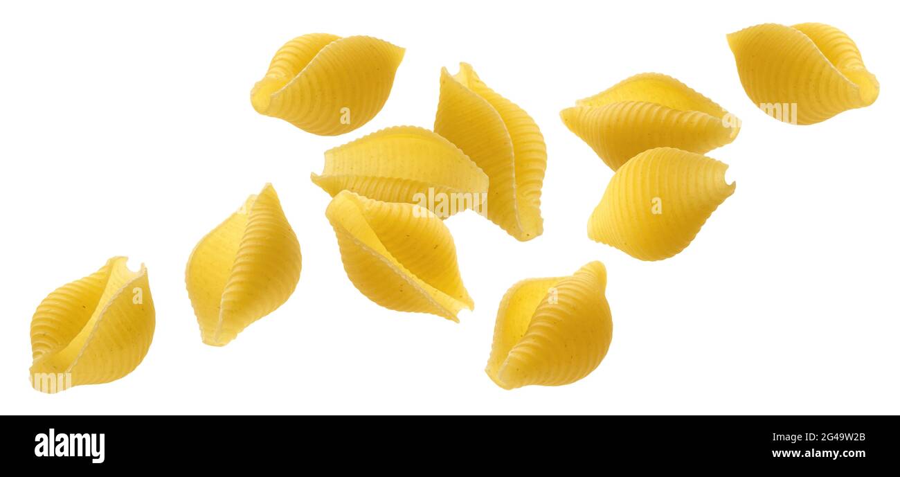 Falling striped shell pasta isolated on white background Stock Photo