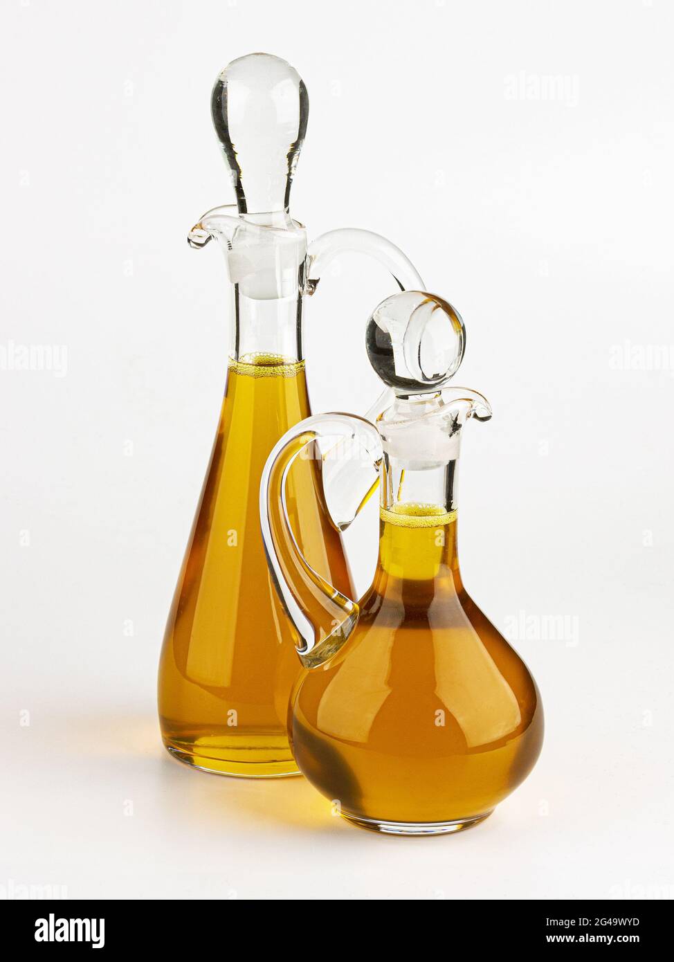 Glass decanter with olive oil on white background Stock Photo