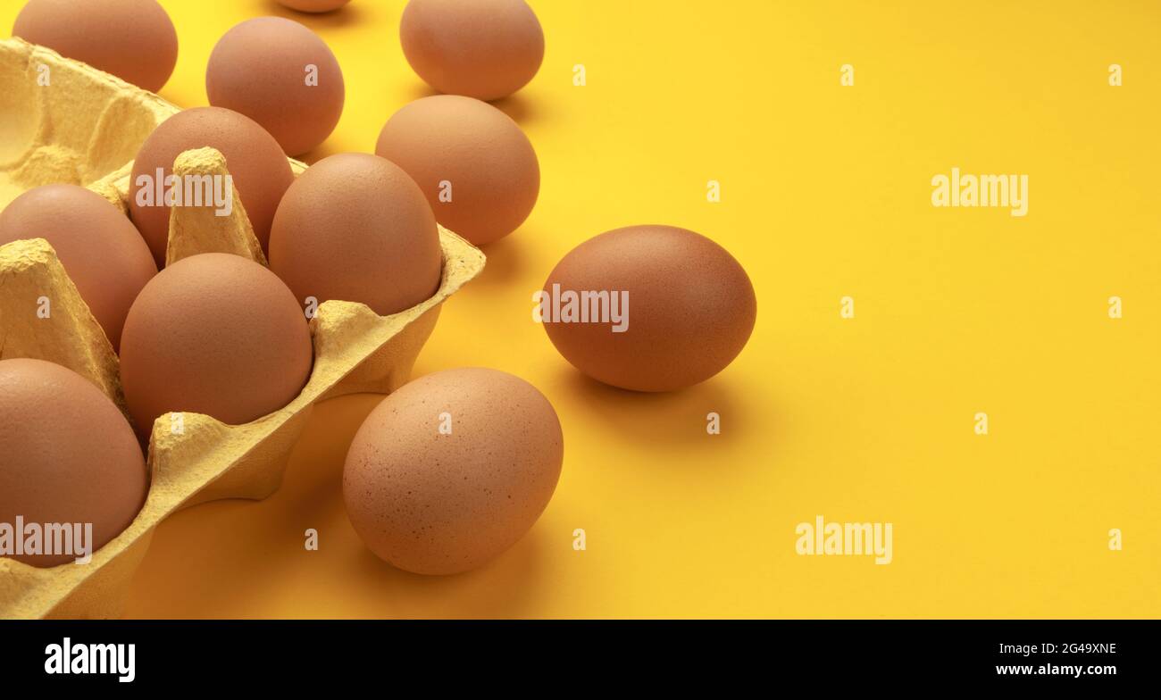 Brown chicken eggs in cardboard box Stock Photo