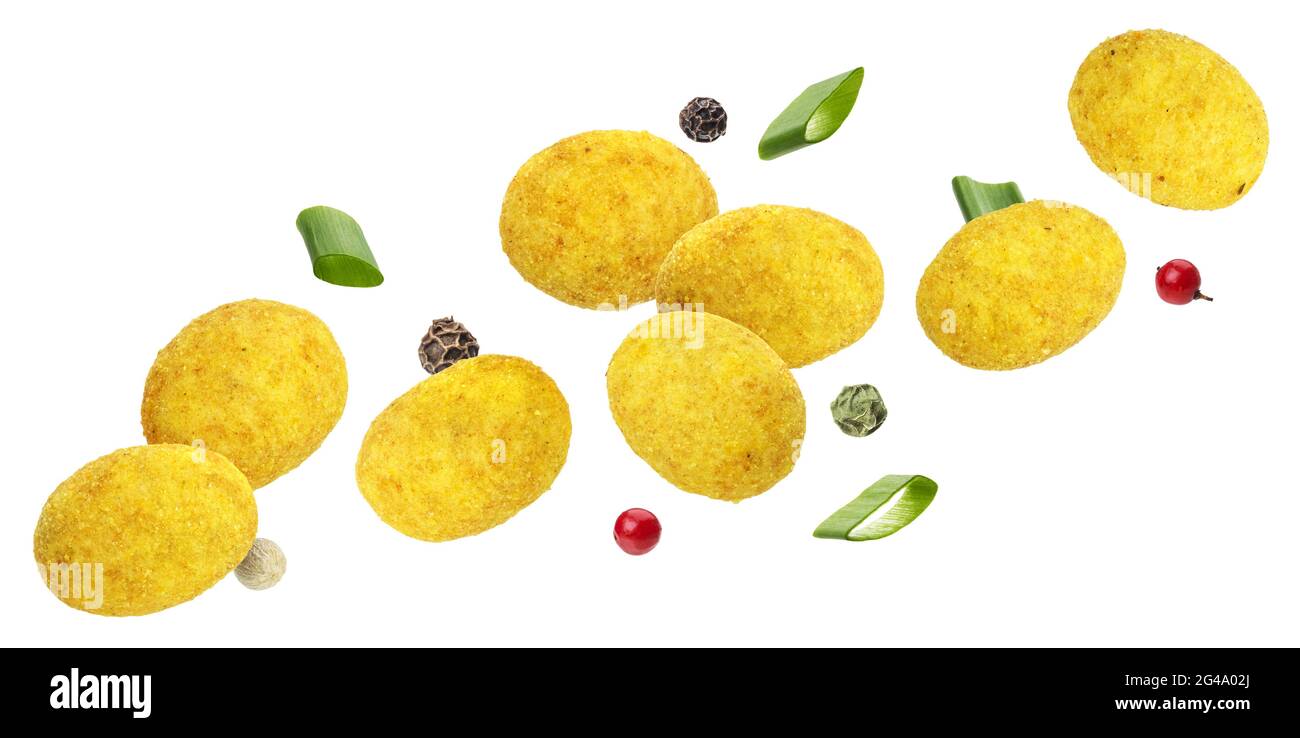 Falling coated peanuts isolated on white background Stock Photo