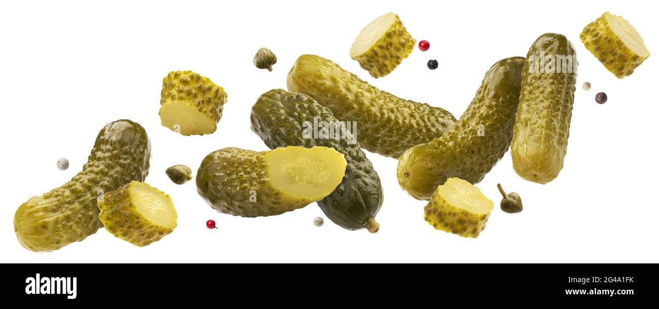 Pickled gherkins, marinated cucumbers isolated on white background Stock Photo
