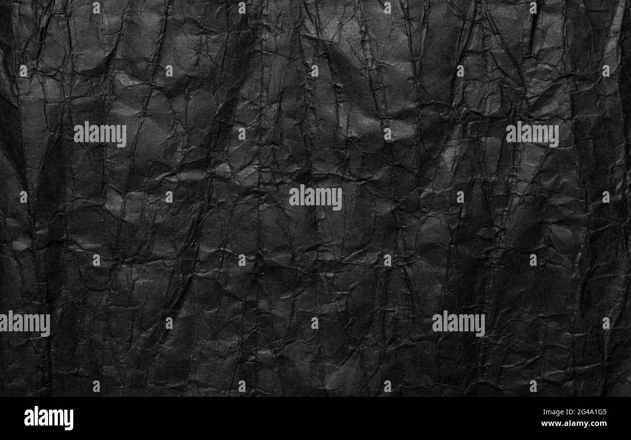 Black crumpled paper texture, grunge background Stock Photo