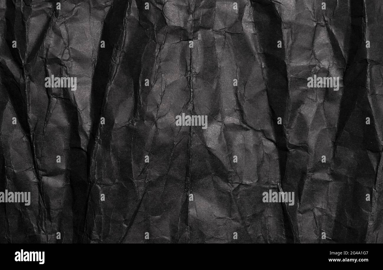 Black crumpled paper texture, grunge background Stock Photo