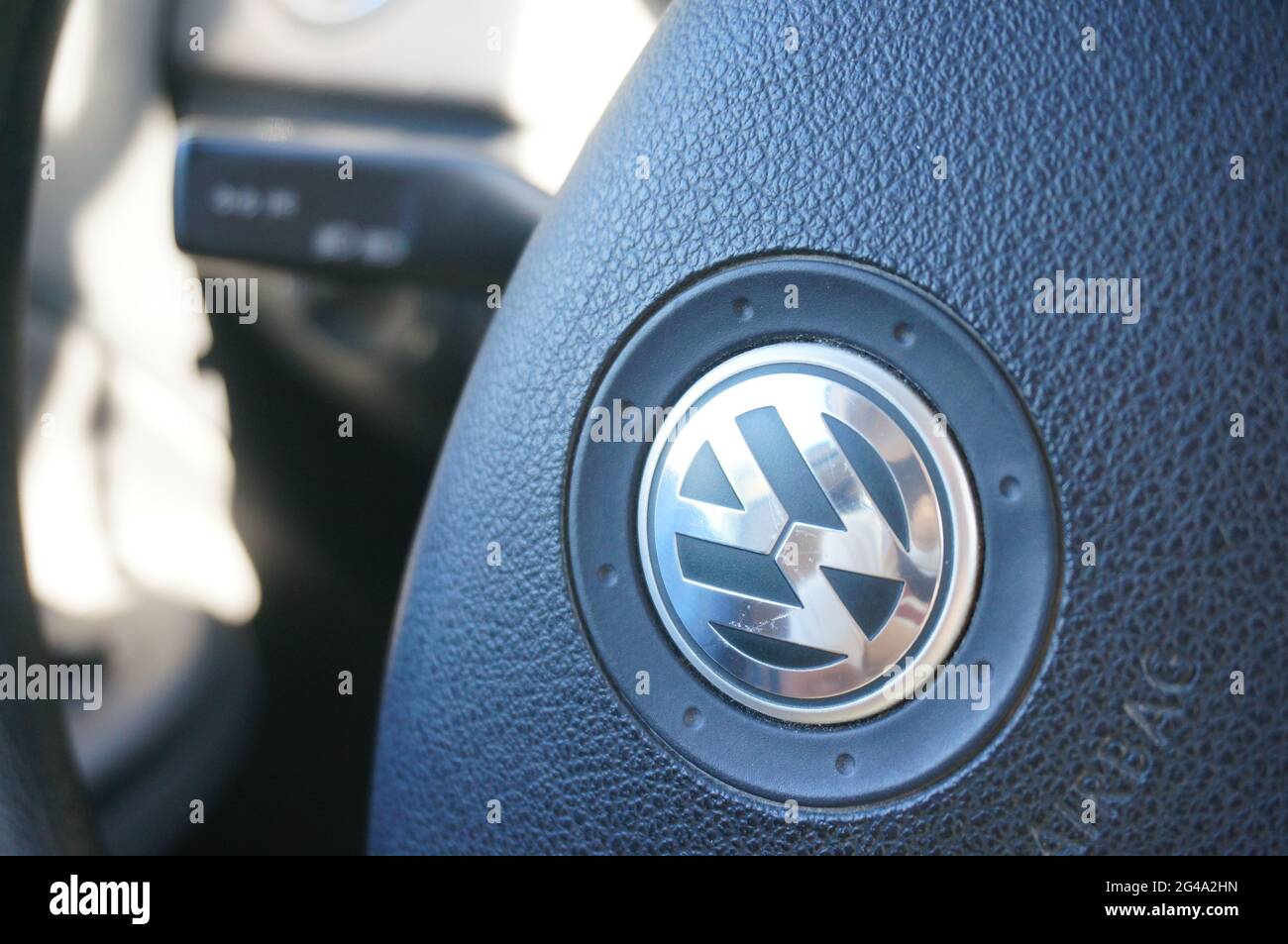 POZNAN, POLAND Jun 06, 2021 Steering wheel of a Volkswagen car with company logo Stock Photo
