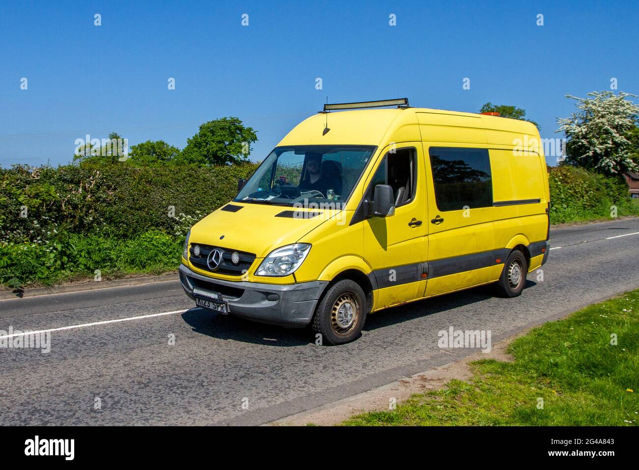 2011 Mercedes Benz Sprinter 313 CDI yellow window van Stock Photo - Alamy