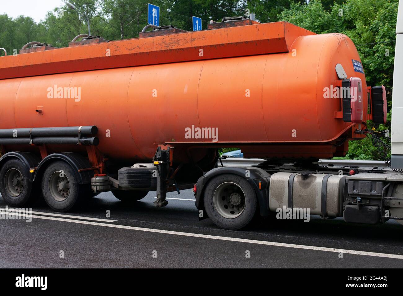 Fuel truck. Carrier of gas products. Transportation of gasoline. Truck on the highway. Dangerous cargo. Tank with fuel. Stock Photo