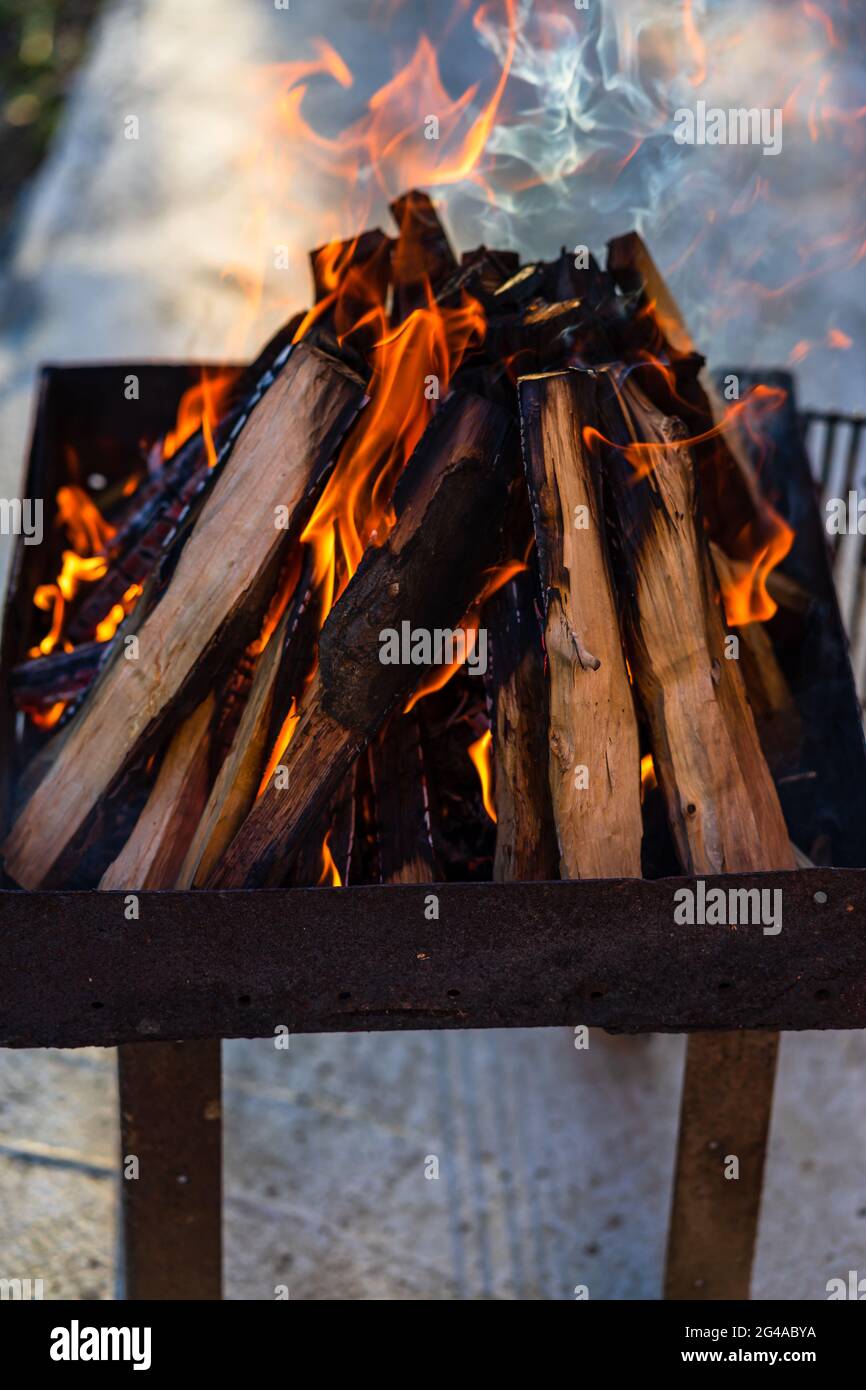 Burning wood chips to form coal. Barbecue preparation, fire before ...