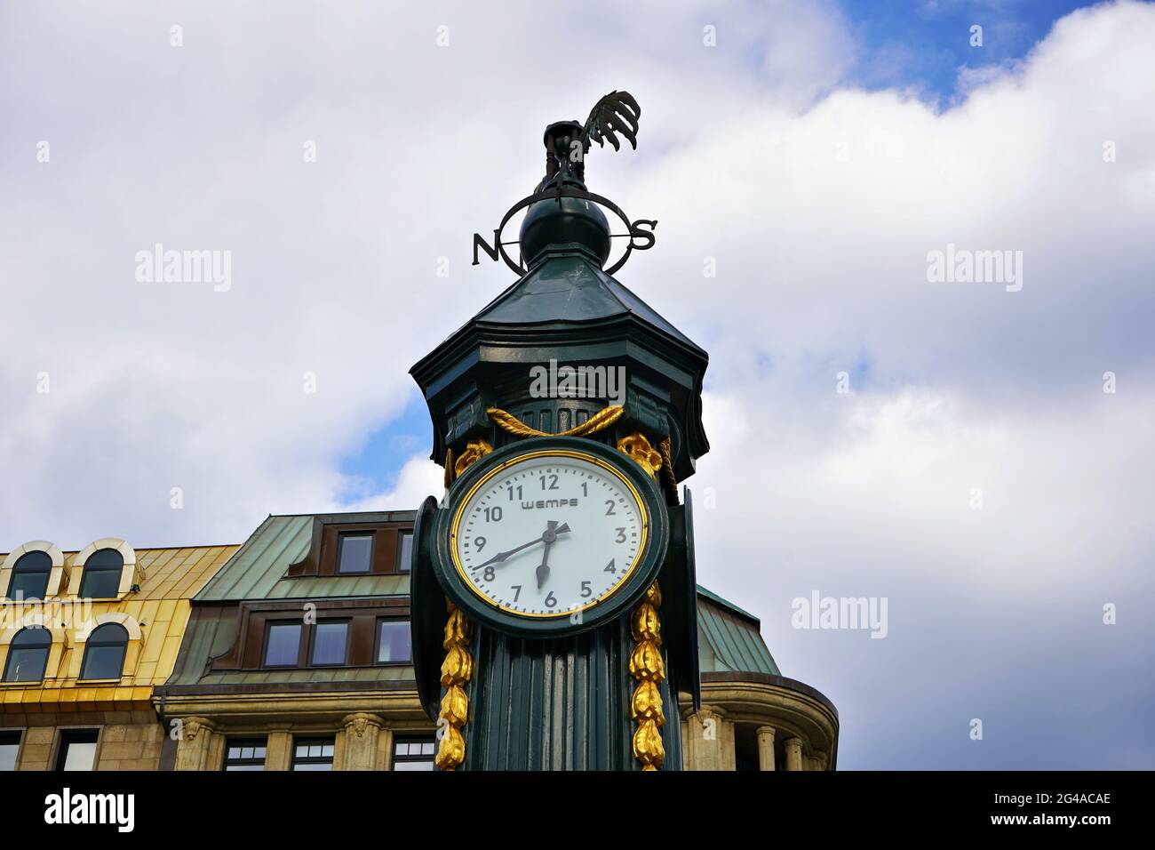Green cast iron vintage clock in downtown Düsseldorf, which is nicknamed 'Schlanke Mathilde' or Grüne Mathilde' by the locals. Stock Photo