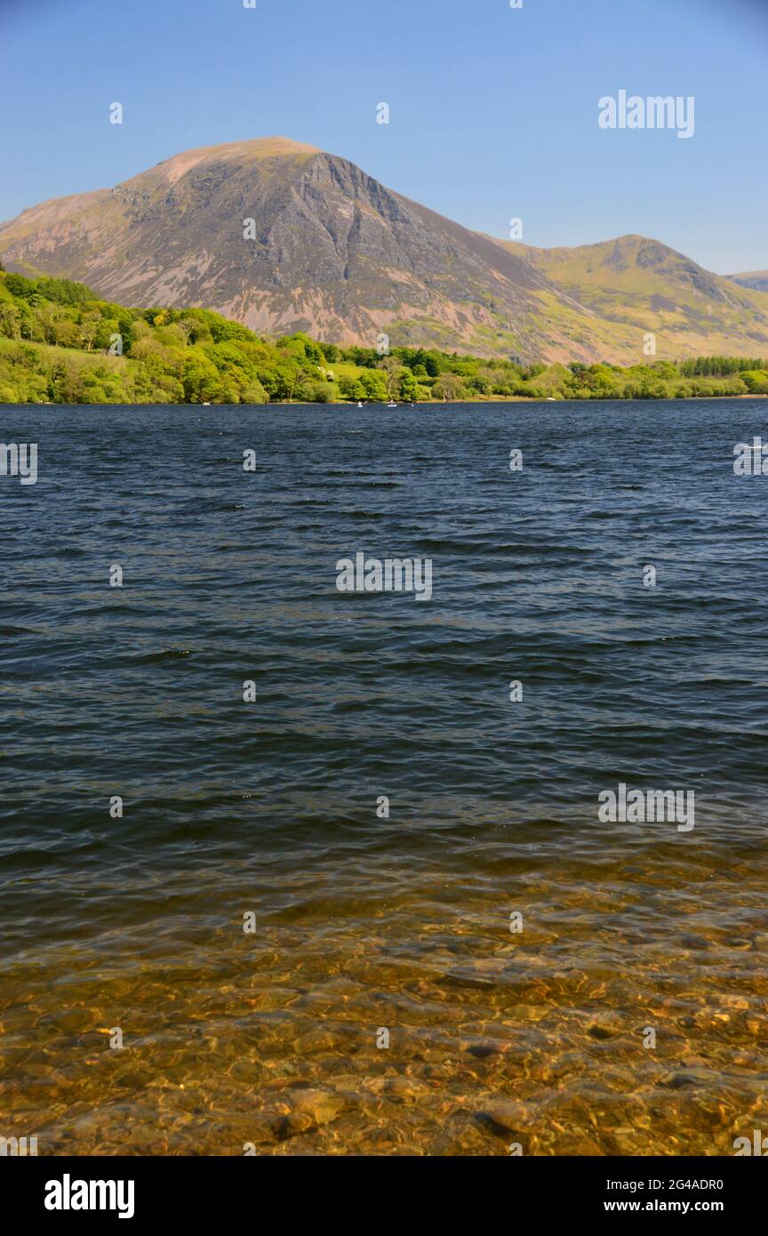 The Wainwrights Grasmoor & Whiteless Pike with Loweswater Lake from Holme Wood in the Lake District National Park, Cumbria, England, UK. Stock Photo