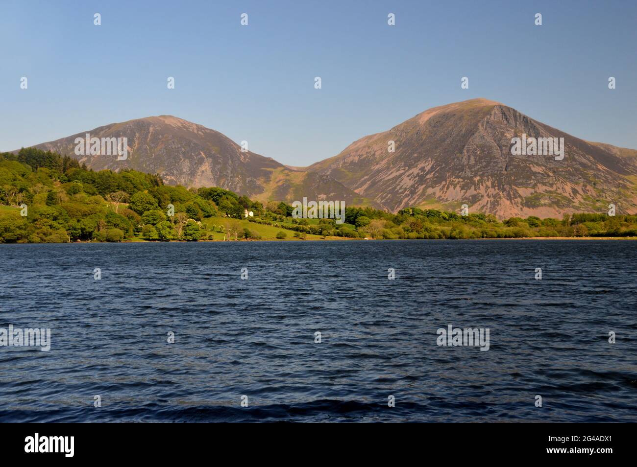The Wainwrights Whiteside & Grasmoor with Loweswater Lake from Holme Wood in the Lake District National Park, Cumbria, England, UK. Stock Photo