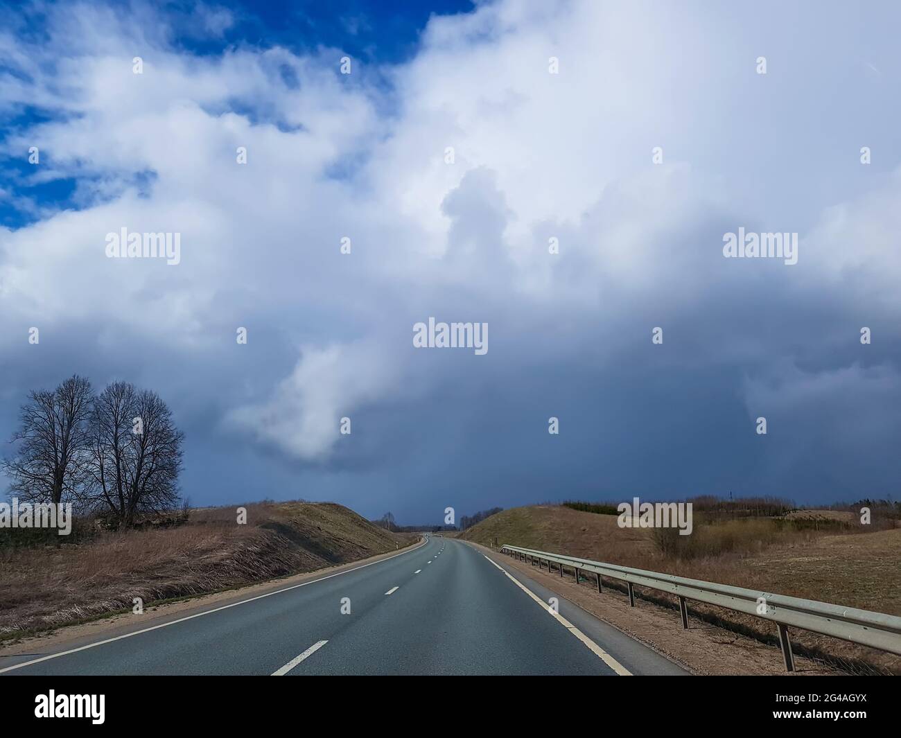 Asphalt road and clouds on sky Stock Photo - Alamy