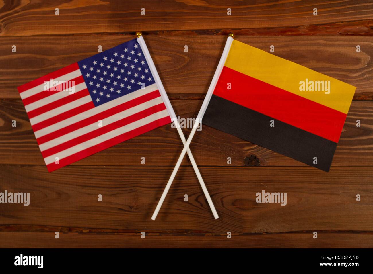 Flag of USA and flag of Germany crossed with each other. USA vs Germany. The image illustrates the relationship between countries. Photography for vid Stock Photo