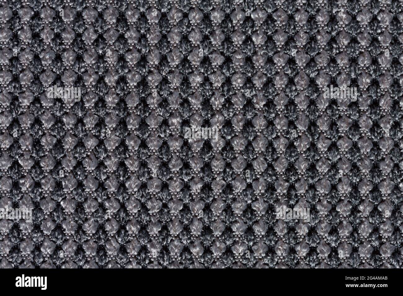 Precise material texture with grey relief surface. Stock Photo