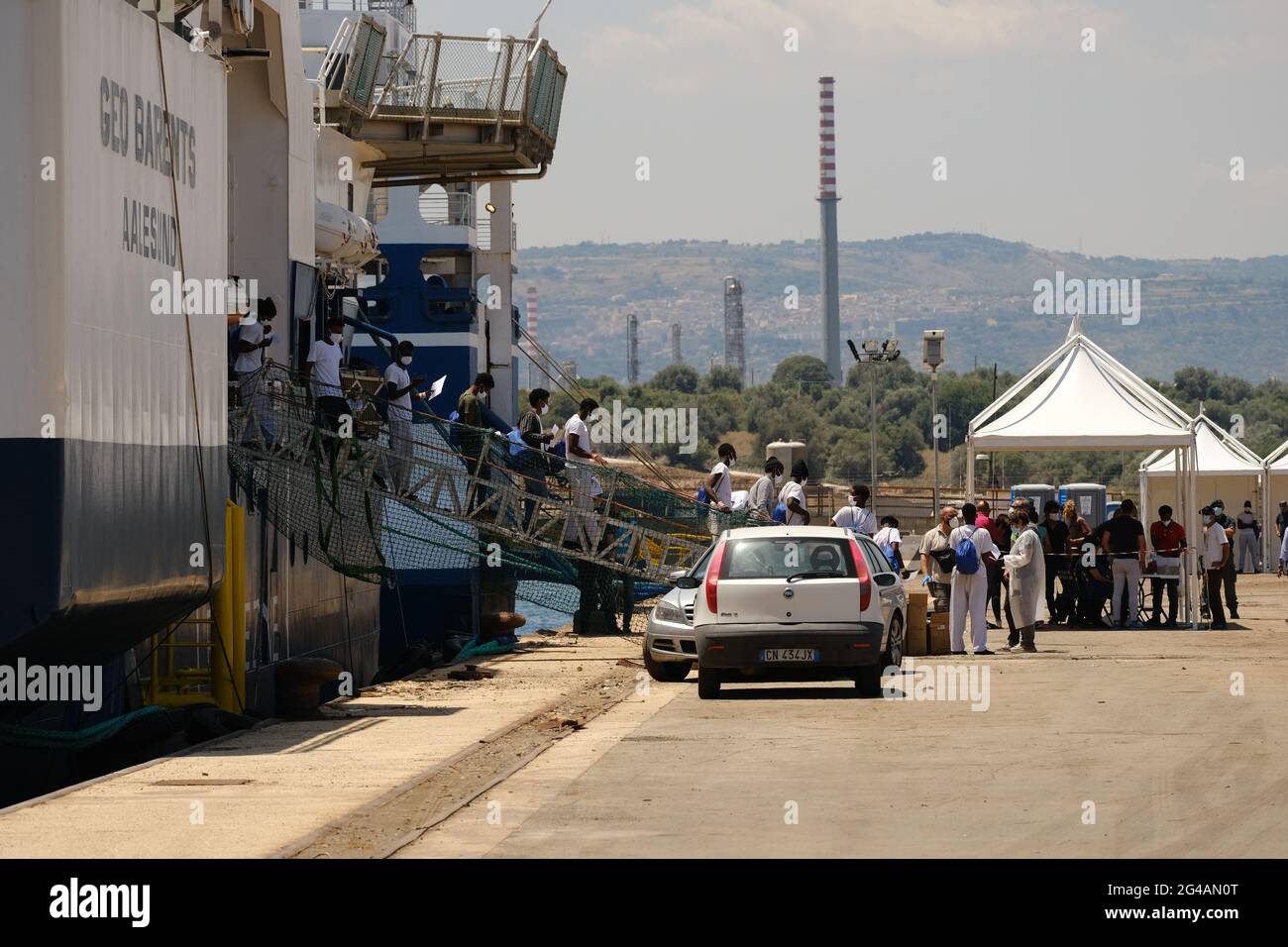 AUGUSTA, SICILY, ITALY – JUNE 18: 415 migrants rescued by Geo Barents vessel of Doctors Without Borders arrived in Augusta for disembarkation on 2021 in Sicily. 'In less than 48 hours, seven rescues and 410 persons saved from drowning,' tweeted the humanitarian organization Doctors without Borders (MSF) on Saturday, June 12. Among those rescued are women and children.The Geo Barents is the largest search-and-rescue ship of the six the NGO has worked with until now. It has capacity for 300 people and is carrying a ton of medicines, 1,200 blankets and 12.5 tons of food. Stock Photo