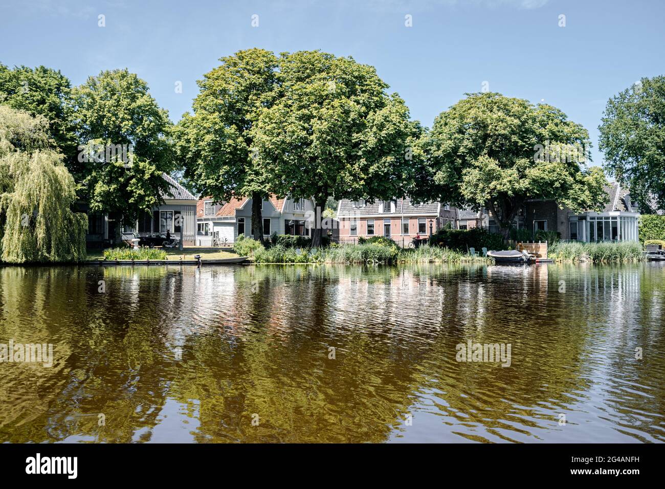 Boat tour through Broek in Waterland, a typical Dutch village in the  Netherlands Stock Photo - Alamy