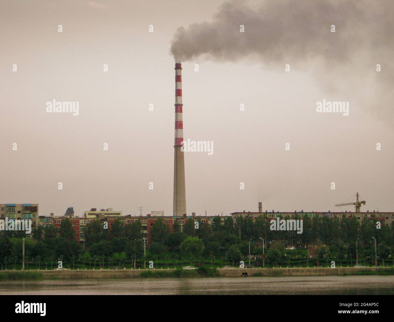 The smoking chimney needs to be changed for green energy, but where the solar and wind resources are insufficient carbon capture and storage is needed Stock Photo