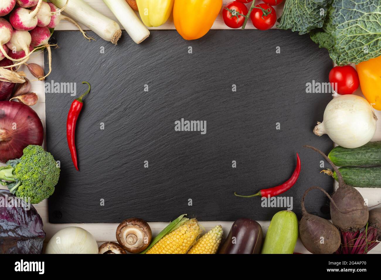 Organic food frame. Fresh raw vegetables from the home garden. On a ...