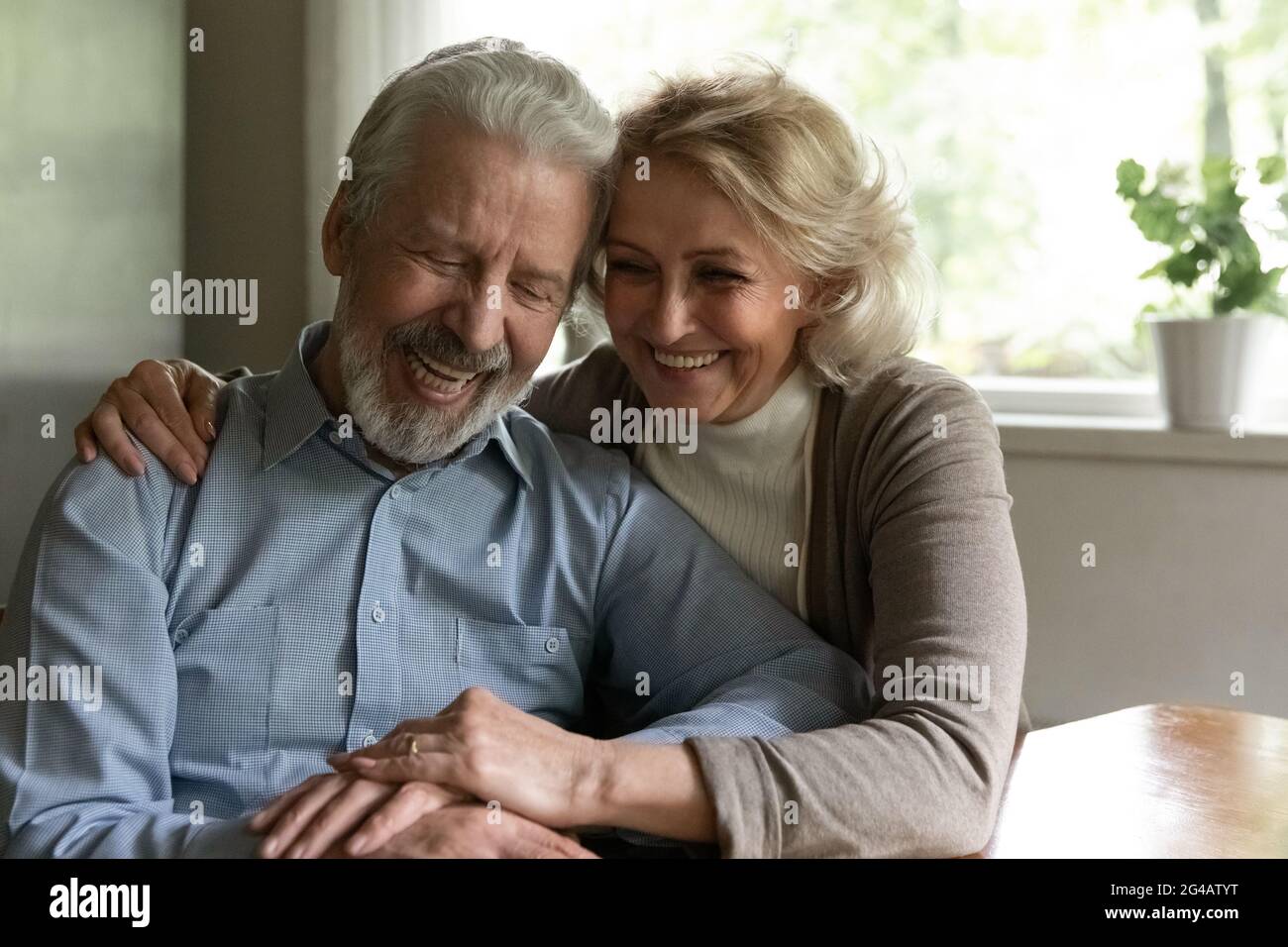 Happy old couple enjoy maturity together at home Stock Photo