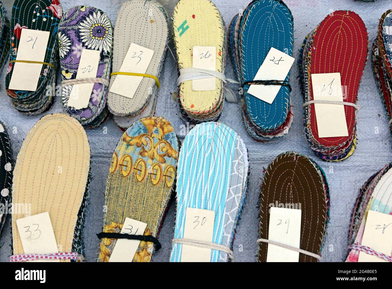 Shoe insoles of different sizes on sale at a street market in a ...