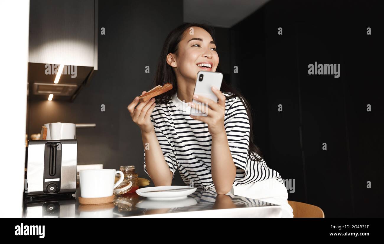 Girl eating toast breakfast hi-res stock photography and images - Alamy