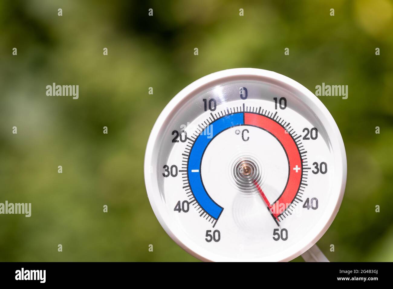 Outdoor thermometer with celsius scale shows extreme hot temperature 50 degree - summer heatwave concept Stock Photo
