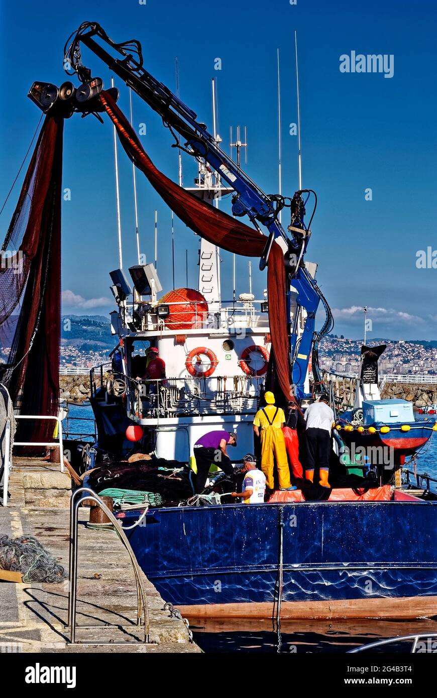 Cangas de Morrazo, Pontevedra, Spain. 12th Aug, 2013.  Fishing boat at work in the port Stock Photo